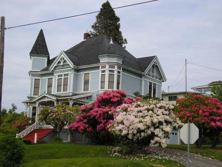 Light blue house with flowers